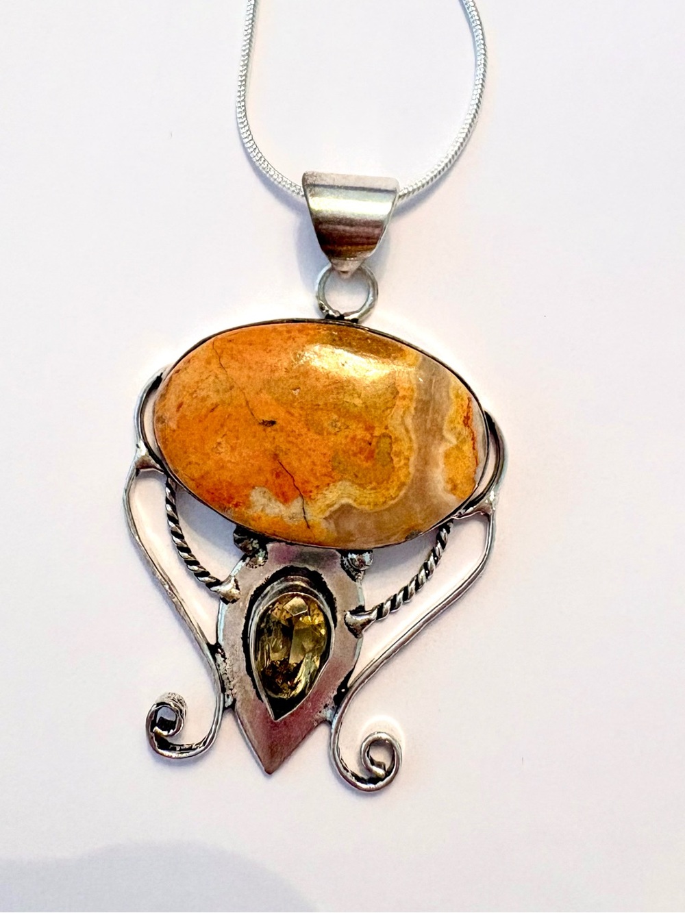 2 inch, 925 marked, Bumble Bee Jasper and Citrine pendant on a silver chain.